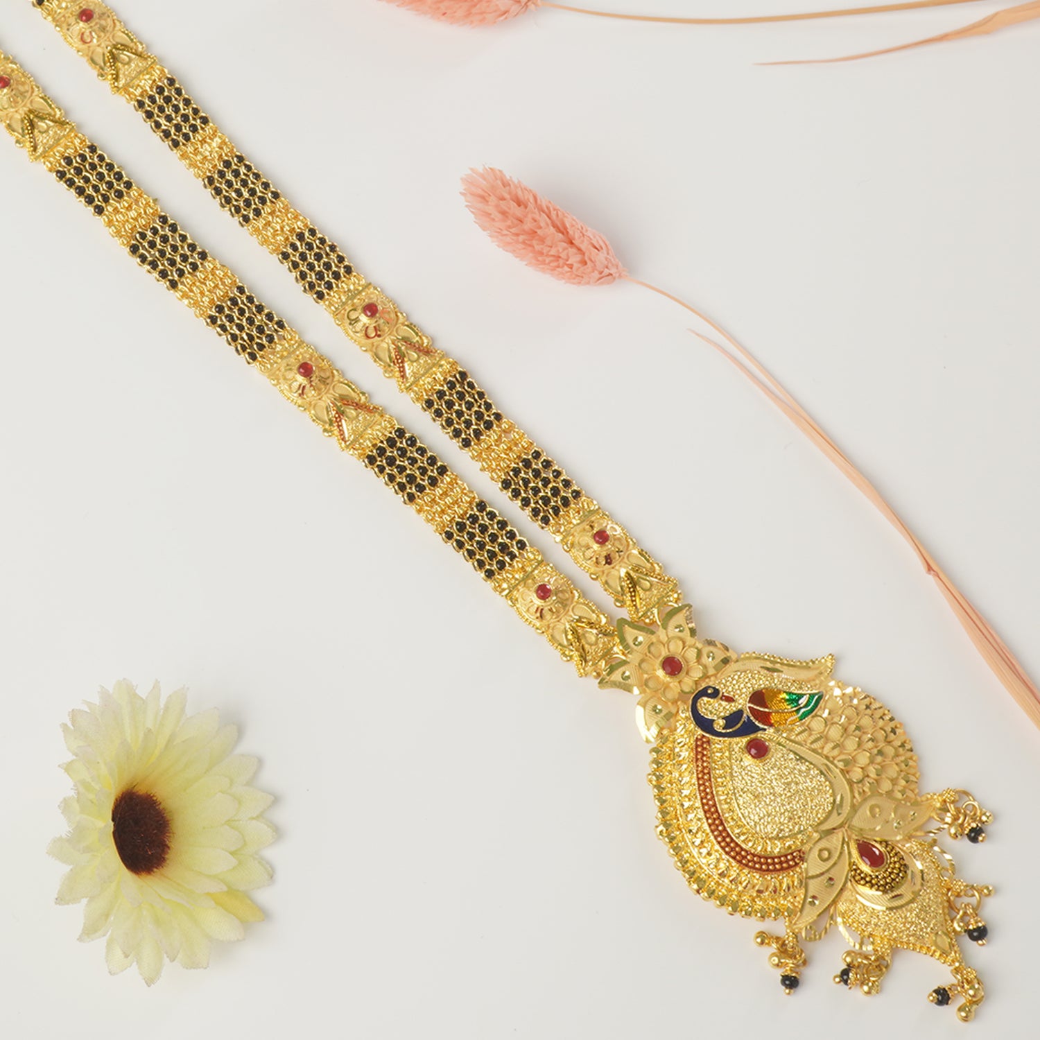 Shop Forming Gold Plated 36 Inches Long Patti Design Mangalsutra With Peacock Pendant