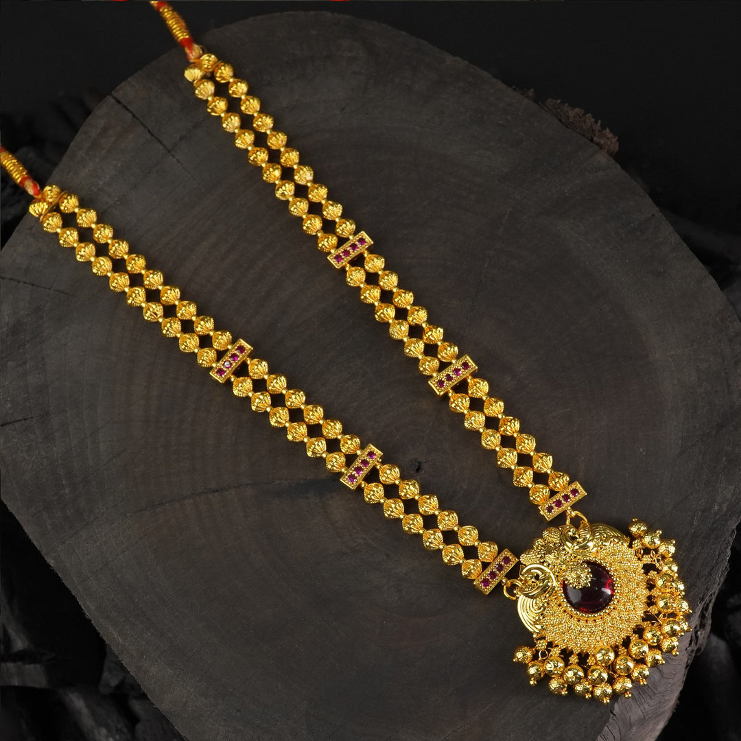 kolhapuri gold plated necklace with a peacock pendant