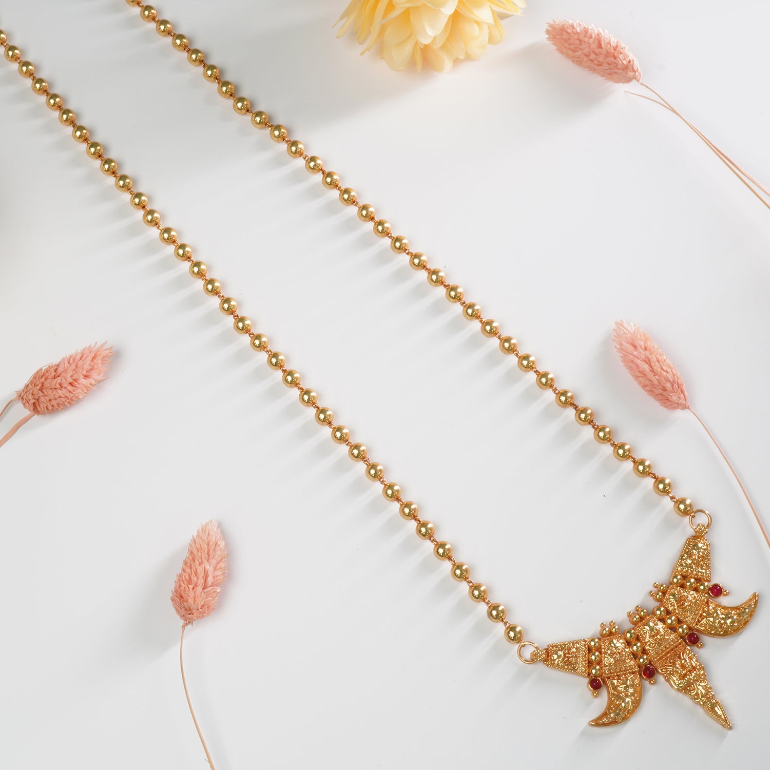 Shop Long Gold Plated Gheru Finish Beads Necklace With Gold Look-a-like Waghnakhi Pendant