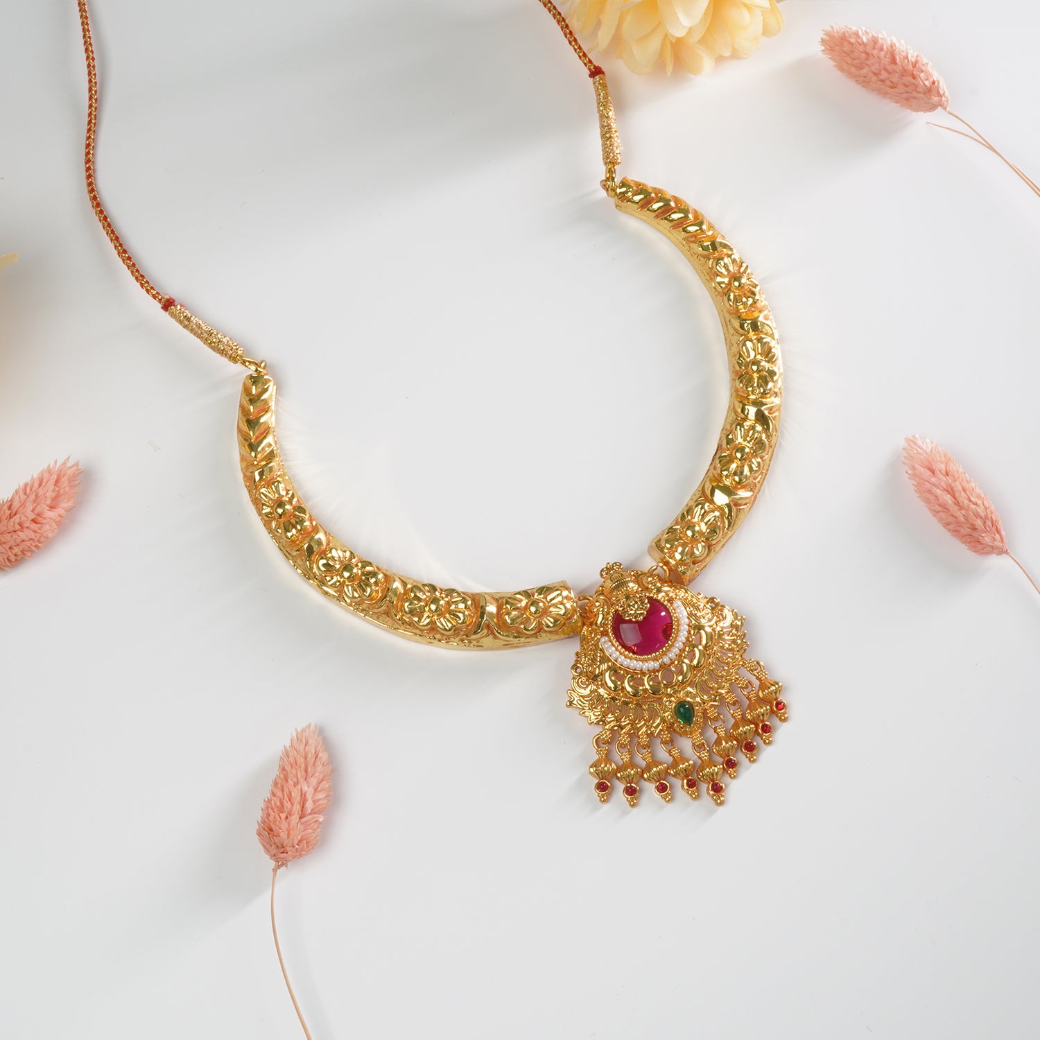 Shop gold plated hasli in regal design and gold look-a-like pendant