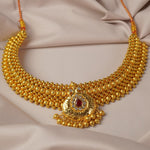 broad kolhapuri thushi design with an stone studded peacock pendant