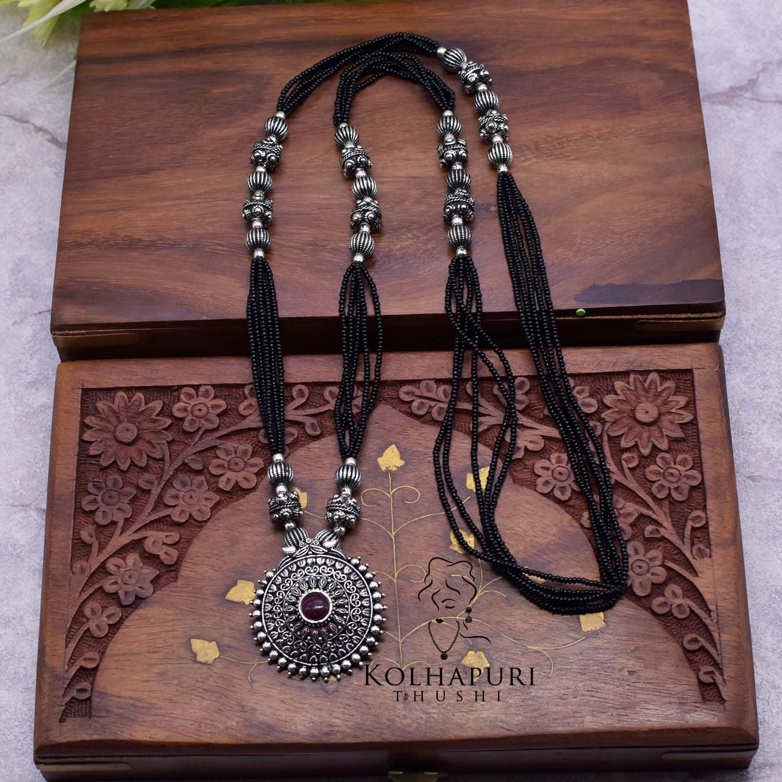 Oxidized long manchali rava peacock pendal