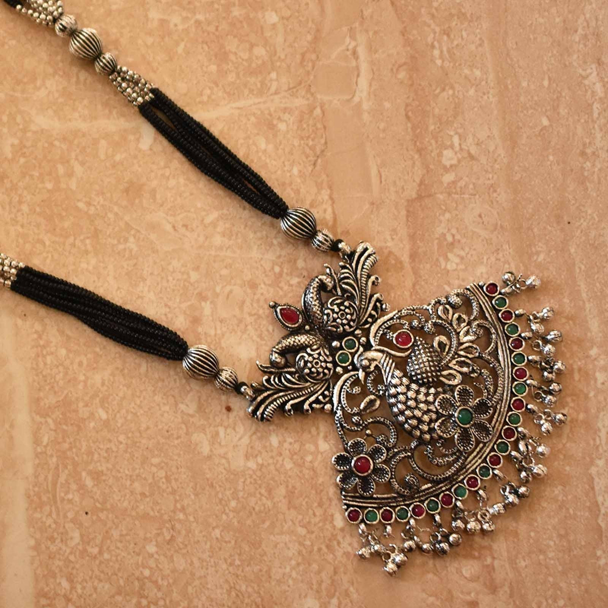 Oxidized manchali vrudangini double peacock pendal