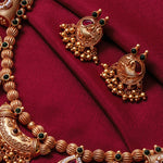 a close lookup at kolhapuri peacock earrings